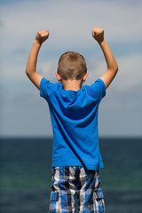 Boy with clenched fists