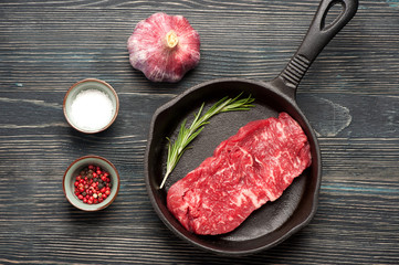 Raw steak Ribeye entrecote in pan.