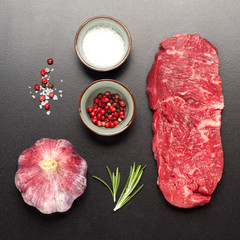 raw steak Ribeye entrecote on black stone background