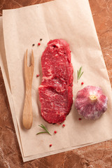 Raw steak Ribeye entrecote, spices and herbs. top view