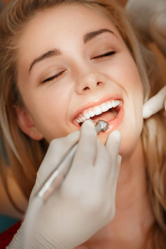 Dentist woman teeth whitening dental clinic