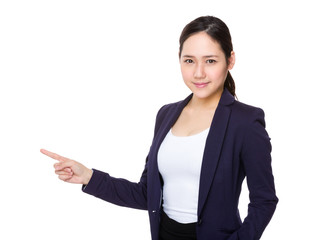 Young businesswoman with finger point aside