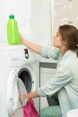 Beautiful girl doing laundry