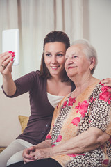Granddaughter and grandmother taking selfie
