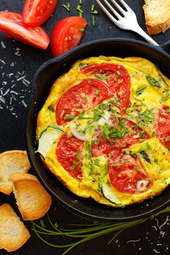 Vegetarian frittata with tomtoes end fresh chive