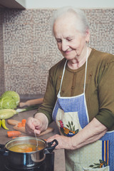 Grandmother cooking on a stove
