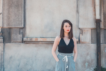 Beautiful brunette posing in an industrial context