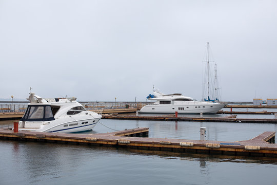 luxury yachts parked in a bay on the sea
