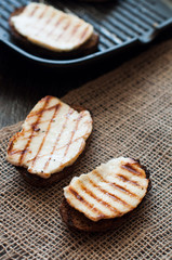 Crostini with fried cheese on the grill