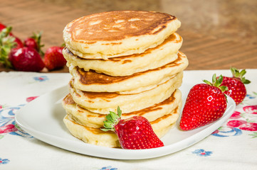 Stack of pancakes with strawberries