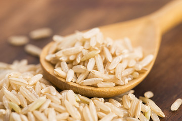 Spoon of brown rice close up
