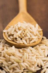 Spoon of brown rice close up