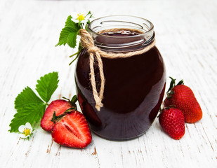 Strawberry jam and fresh strawberries