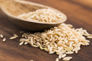 Spoon of brown rice close up