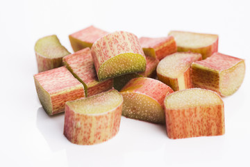 chopped red rhubarb on white background