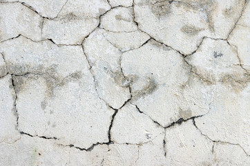 Wall with plaster all in the cracks under the influence of weath