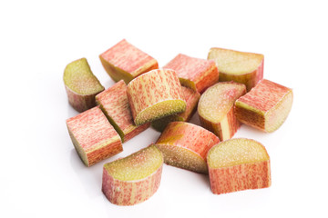 chopped red rhubarb on white background