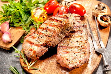 Grilled veal steaks on cutting board