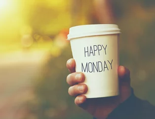 Keuken spatwand met foto hand holding paper cup of coffee with Happy Monday motivational © Ivan Kruk