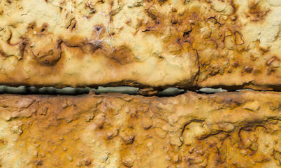 Junction of two rusty metal plates texture background