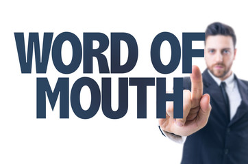 Business man pointing the text: Word of Mouth 