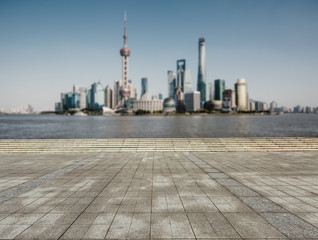 The empty square in front of the  fuzzy modern city, Shanghai, China