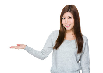 Asian woman with hand showing something