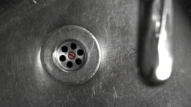 Water running from a tap in the sink