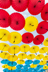 Many open in sky umbrellas  give a guarantee that rain will not