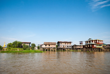 Fototapeta na wymiar Floating houses in a village of Inle lake