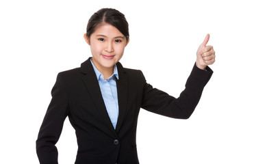 Young businesswoman with thumb up gesture