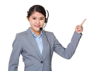 Asian businesswoman with headset and finger point up