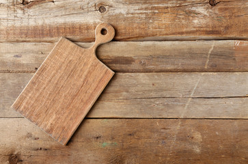 Cutting board on wooden background
