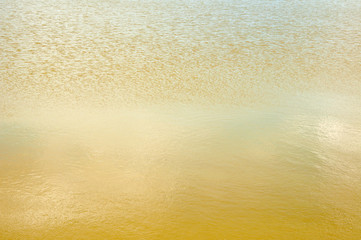 golden water texture background close up