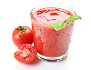 Glass of fresh tomato juice isolated on white
