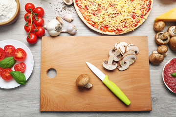 Food ingredients for pizza on table close up