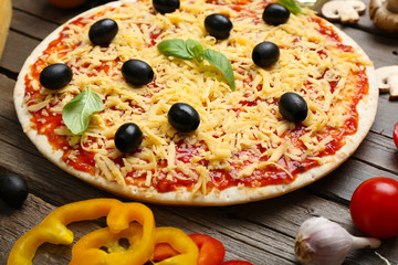 Food ingredients for pizza on table close up