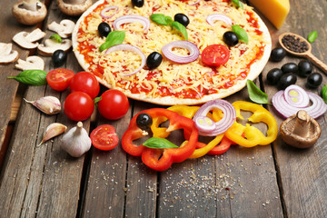 Food ingredients for pizza on table close up