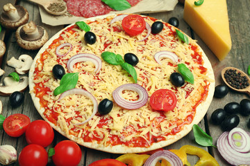Food ingredients for pizza on table close up