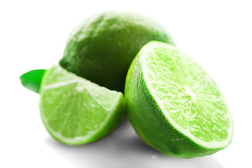 Sliced fresh limes isolated on white