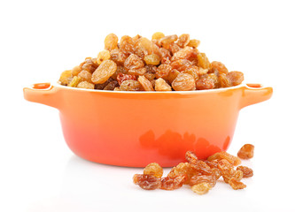 Raisins in pan isolated on white