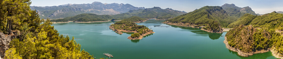 Fototapeta na wymiar Turkey . Panorama . Huge deep lake in the mountains .