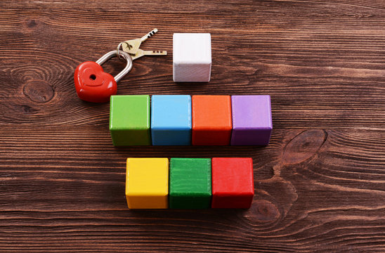 Colorful cubes for inscriptions on wooden background