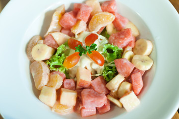 Fruit salad in a white dish