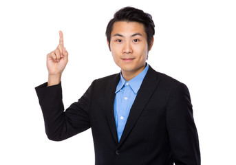 Businessman with finger pointing upwards