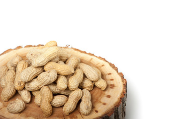 Pile of unshelled peanuts, isolated on white background