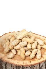 Pile of unshelled peanuts, isolated on white background