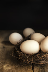 Fresh duck eggs in moody vintage retro style natural lighting se