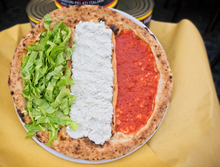 Pizza on the table with fresh ingredients