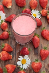 A glass of freshly prepared, delicious strawberry milkshake.
